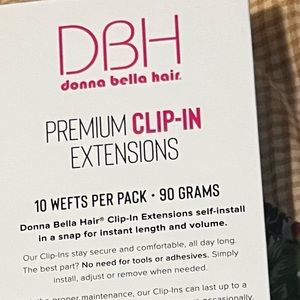 New in the  box Donna Bella clip in extensions 14” ash blonde new in the  box